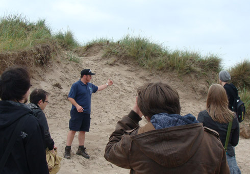 Figure 1: Students from the Summer Phase of the project met with the West Sands ranger to find out more about the coastal defences in St. Andrews, and to gather vital research information and imagery to inform their prototype application.