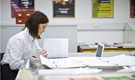 Leah Armstrong working in the University of Brighton Design Archives
