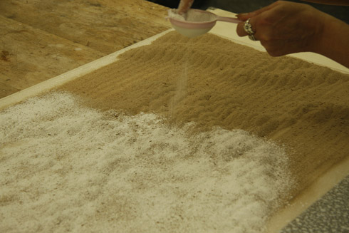Figure 2. ‘Dusting plaster on sand poured by CNC router’. Photo: Katie Broadley